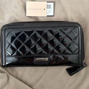 Burberry (authentic)black quilted patent leather zip-around wallet.